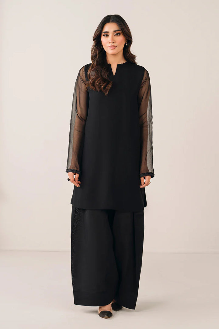 Pakistani semi-formal look with flowy shalwar and embellished shirt
