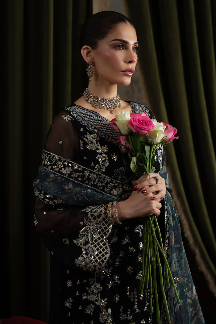 Model wearing Style 75 by Nureh featuring organza daman borders and embroidered neckline

