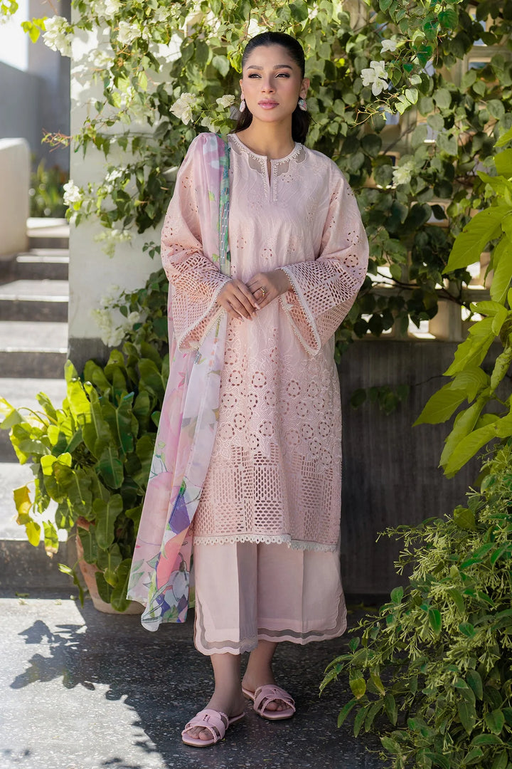 standing pose of Soft pink embroidered lawn suit with silk dupatta and cotton trouser