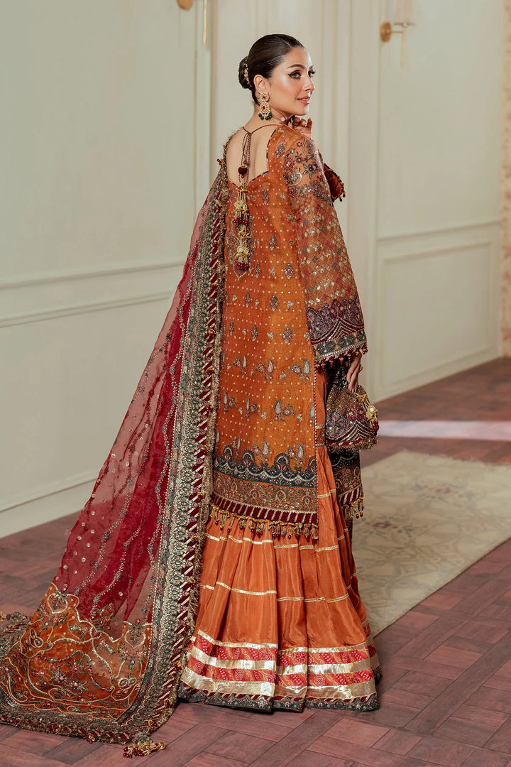 back view of Hand-embroidered Pakistani suit in zari net with velvet and silk detailing