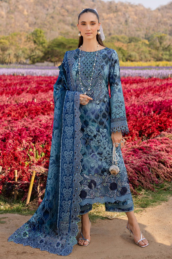Stitched Nureh lawn suit in light and dark blue shades with embroidered shirt, chiffon dupatta, and printed cotton trouser. Elegant 3-piece outfit for seasonal style.
