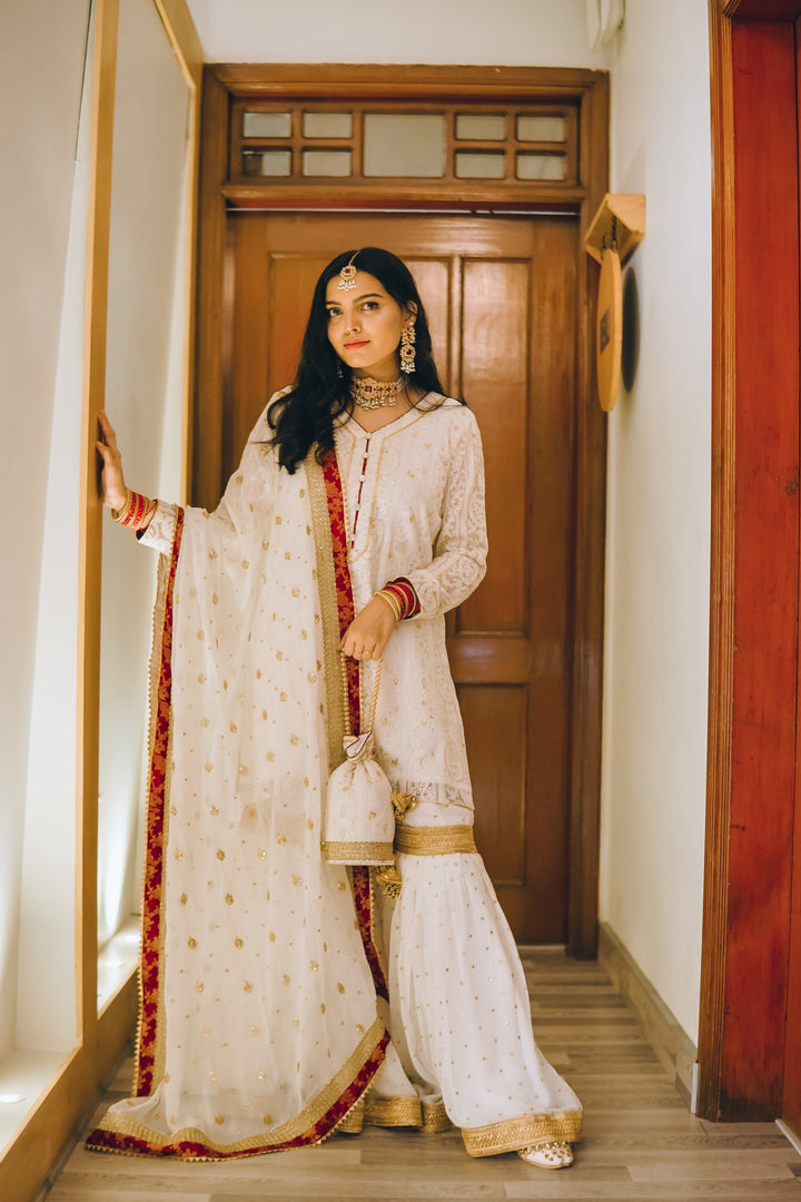 8-piece bridal wedding collection with gharara, potli bag, khussa shoes, and jewelry – perfect for nikaah or wedding functions.