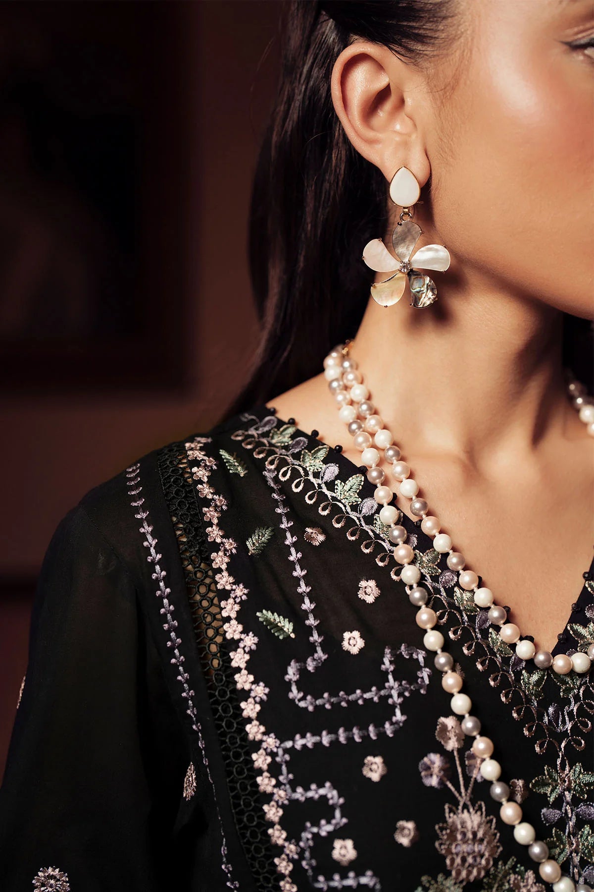 Side view of FE-12 lawn suit highlighting embroidered chiffon dupatta and silhouette
