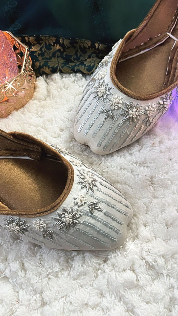 South Asian wedding wear collection including gharara pants, potli bag, khussa jutti, necklace, earrings, and bangles – perfect for Diwali parties.