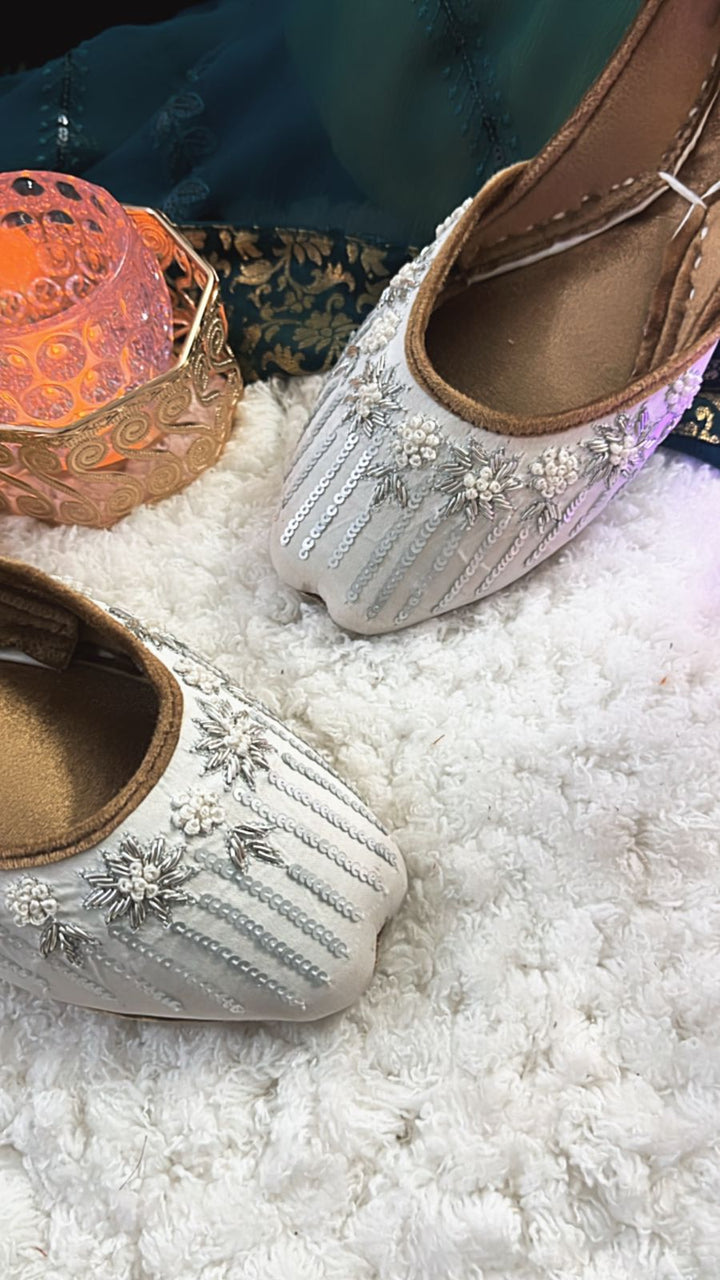 South Asian wedding wear collection including gharara pants, potli bag, khussa jutti, necklace, earrings, and bangles – perfect for Diwali parties.