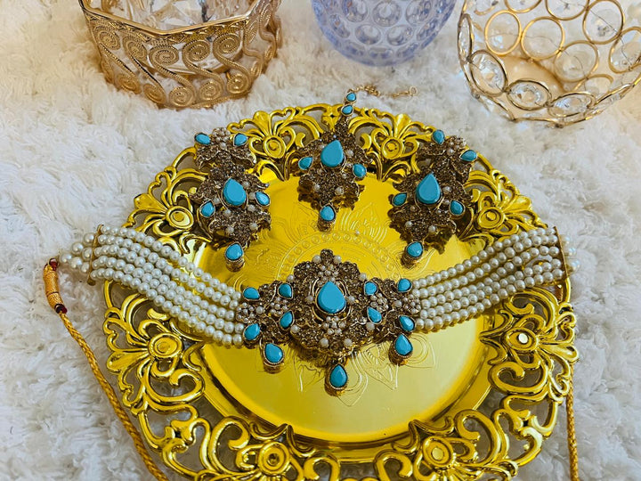 Luxury festive wear set featuring gharara, potli handbag, khussa shoes, and elegant jewelry for Diwali and wedding events.