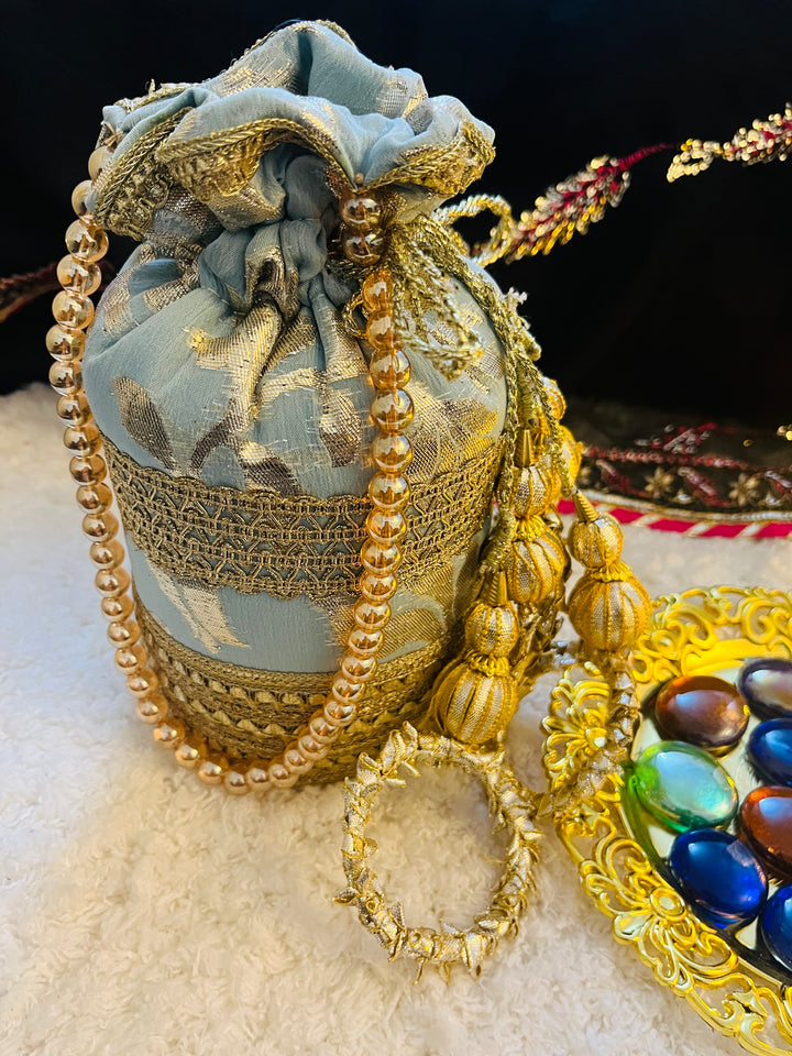 Naaz by Nazia bridal collection with 8 coordinated pieces: gharara outfit, dupatta, potli bag, khussa flats, and matching jewelry – ideal for mehndi.
