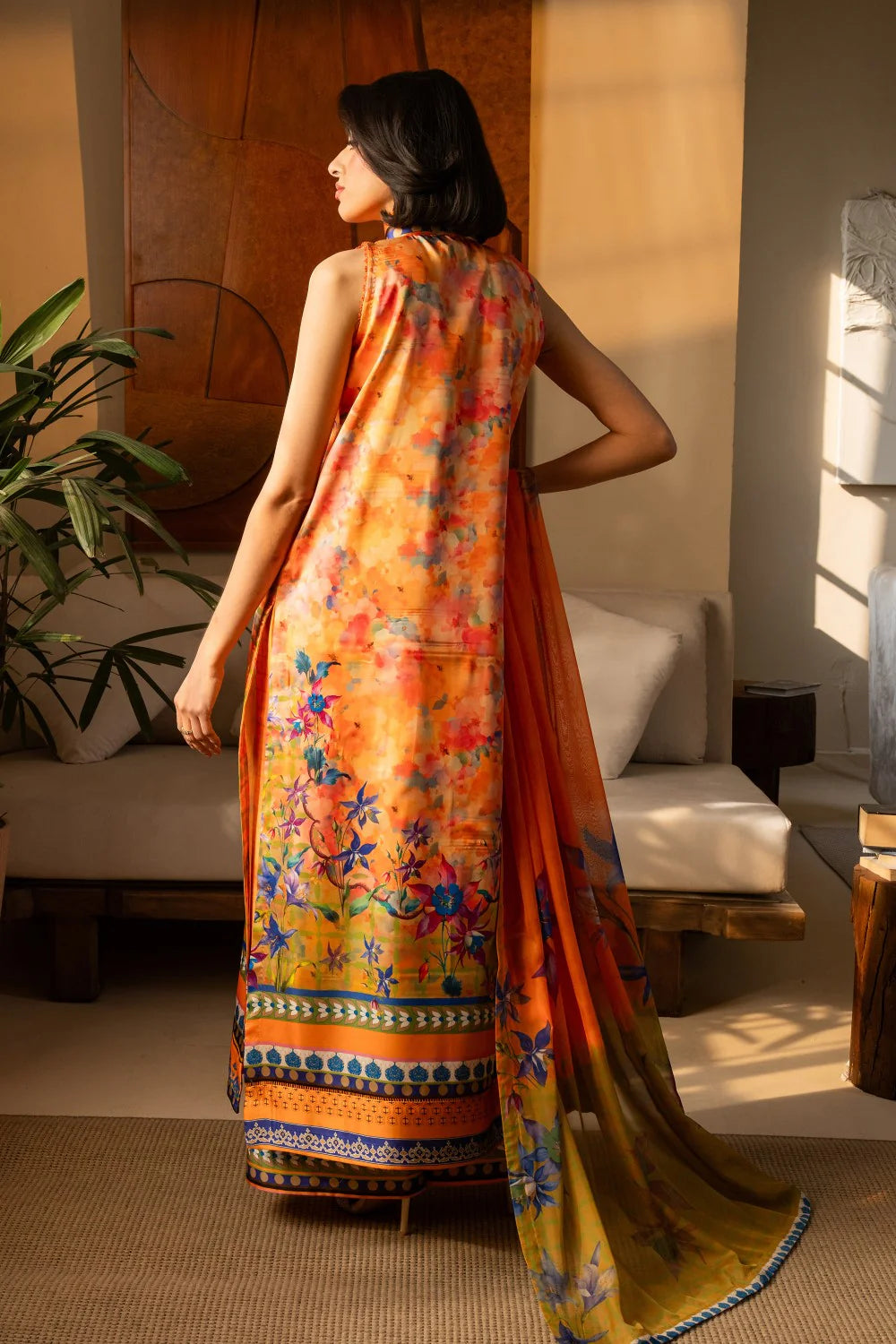 Back view of orange floral silk shirt and printed chiffon dupatta draped gracefully - Maryum N Maria collection