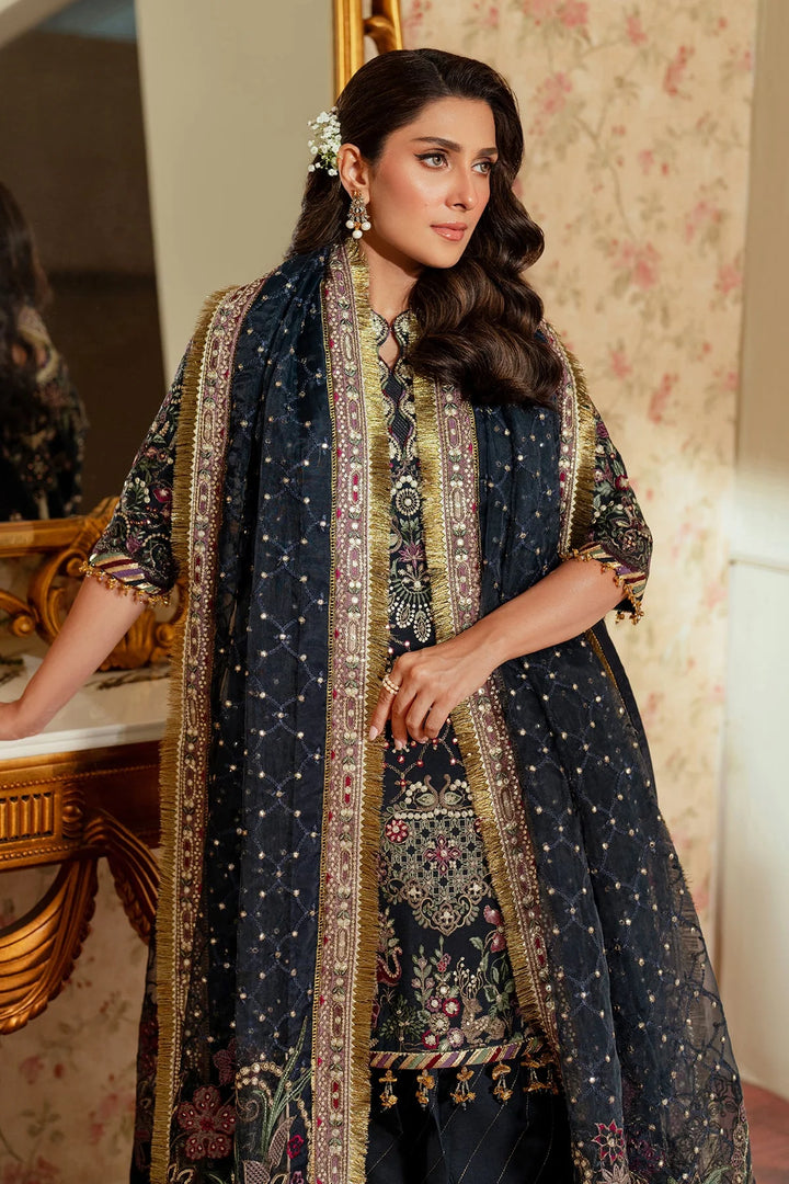 side pose of stitched raw silk Pakistani formal outfit with embroidered dupatta and shalwar
