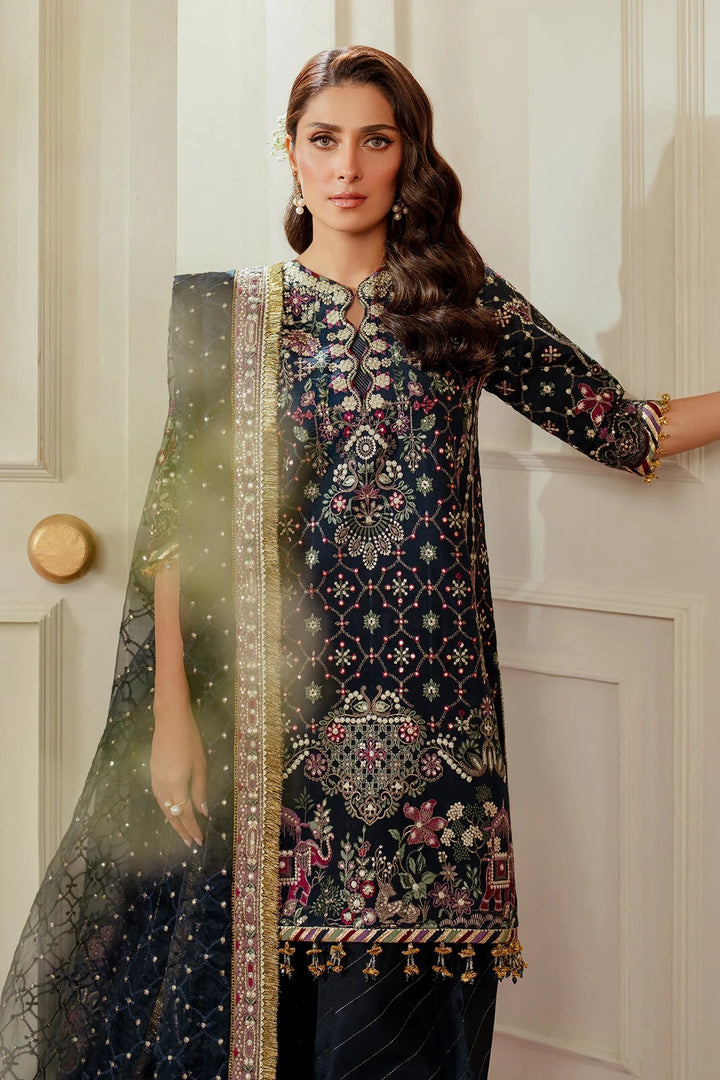 gloomy view of stitched raw silk Pakistani formal outfit with embroidered dupatta and shalwar
