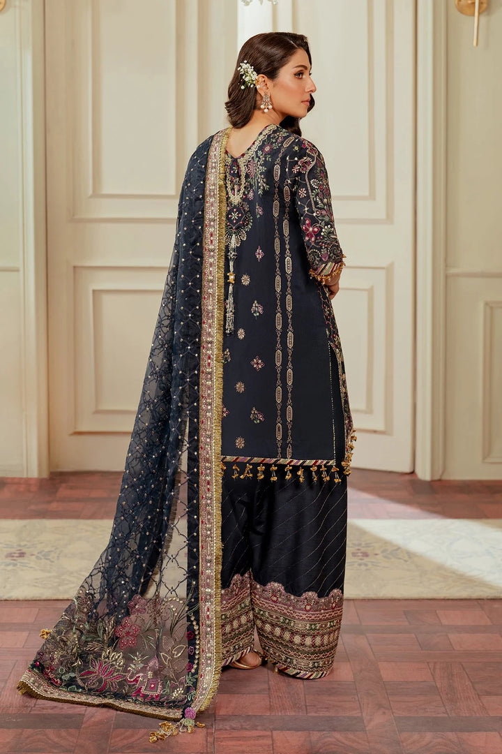 back view of stitched raw silk Pakistani formal outfit with embroidered dupatta and shalwar
