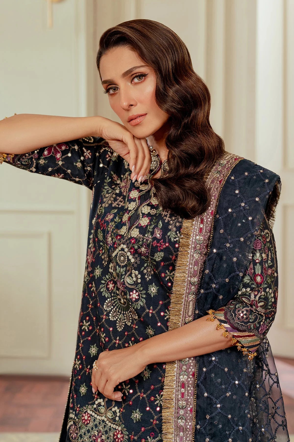 close up front stitched raw silk Pakistani formal outfit with embroidered dupatta and shalwar
