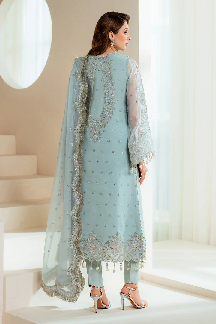 Close-up of Orla stitched neckline with aqua blue hand embellishments and sequin details
