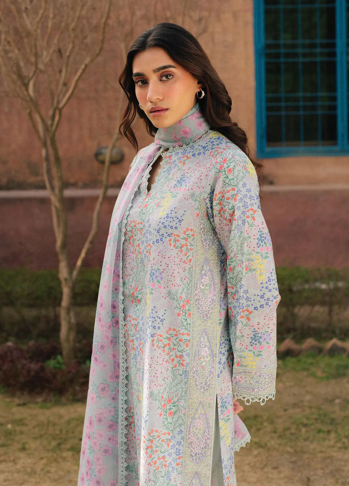 Flat lay of 3-piece embroidered lawn suit with dupatta and trouser
