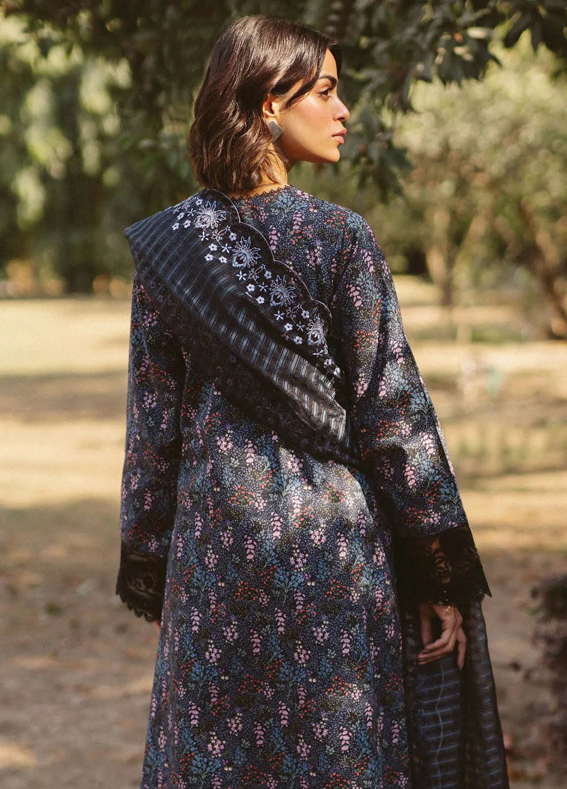 Side profile of model showcasing lawn shirt and dupatta flow