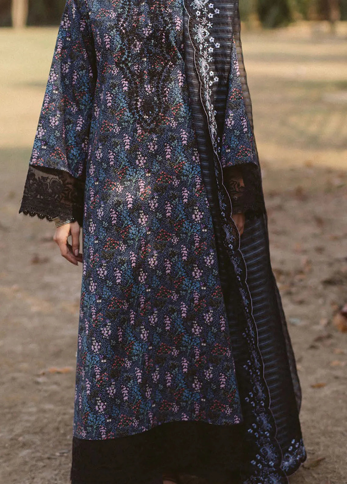 Graceful pose highlighting shirt and dupatta embroidery in natural light