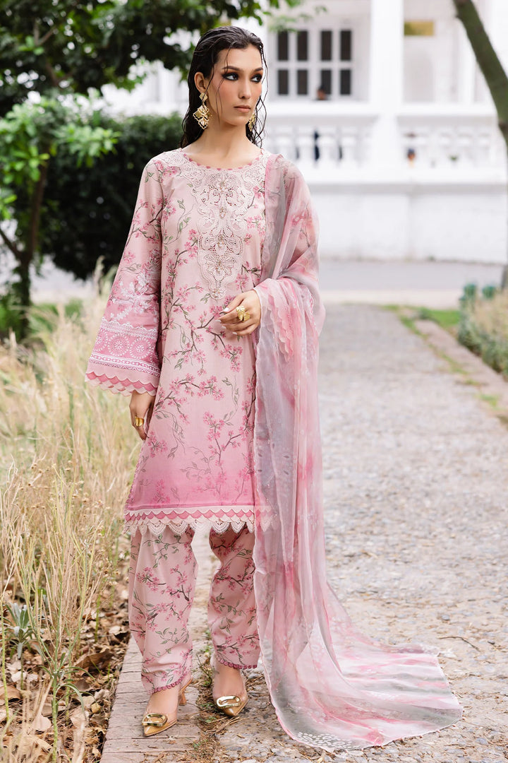 Model wearing Nureh 3-piece lawn suit with printed chiffon dupatta and Chikankari neckline