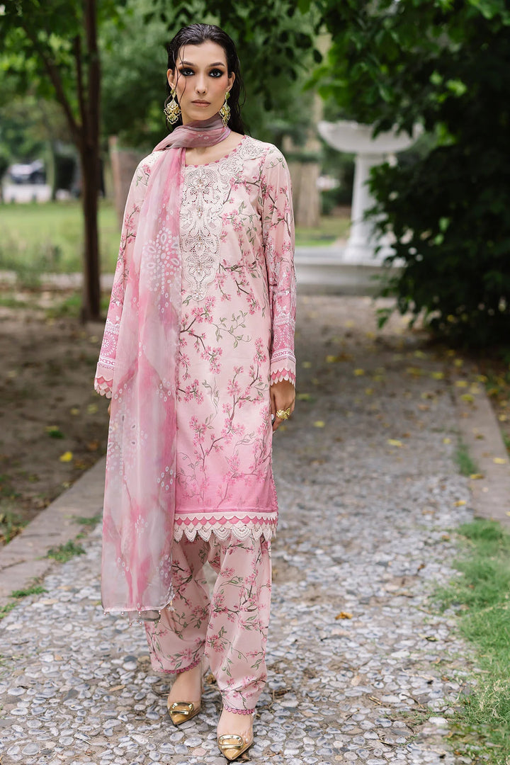 Side view of model showcasing Nureh designer lawn suit with elegant prints