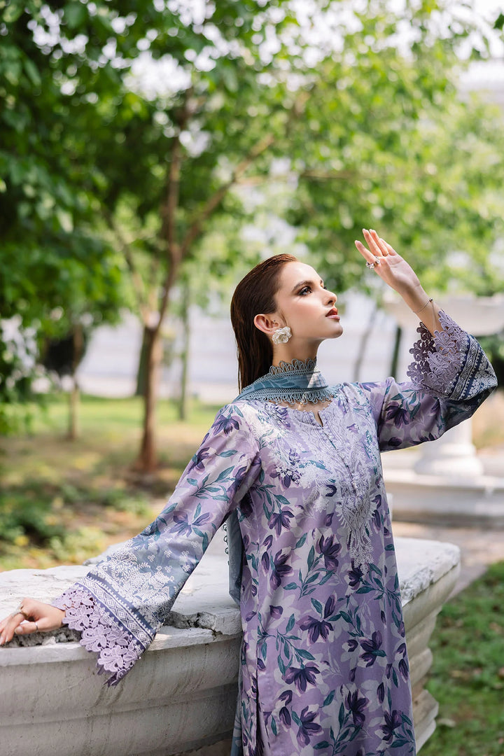 Side view of model showcasing Nureh designer lawn suit with elegant prints