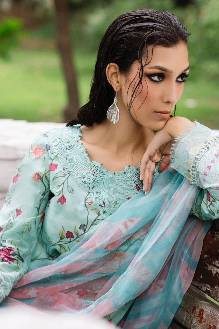 Model seated in Nureh lawn dress, highlighting fabric texture and elegance