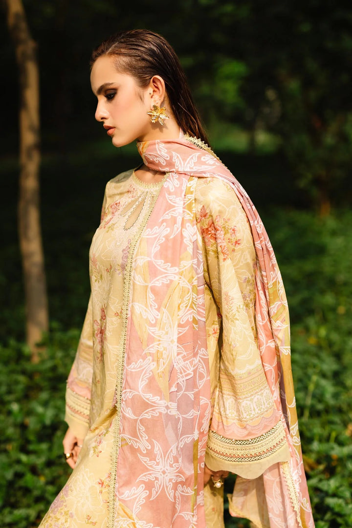 Side view of model showcasing Nureh designer lawn suit with elegant prints