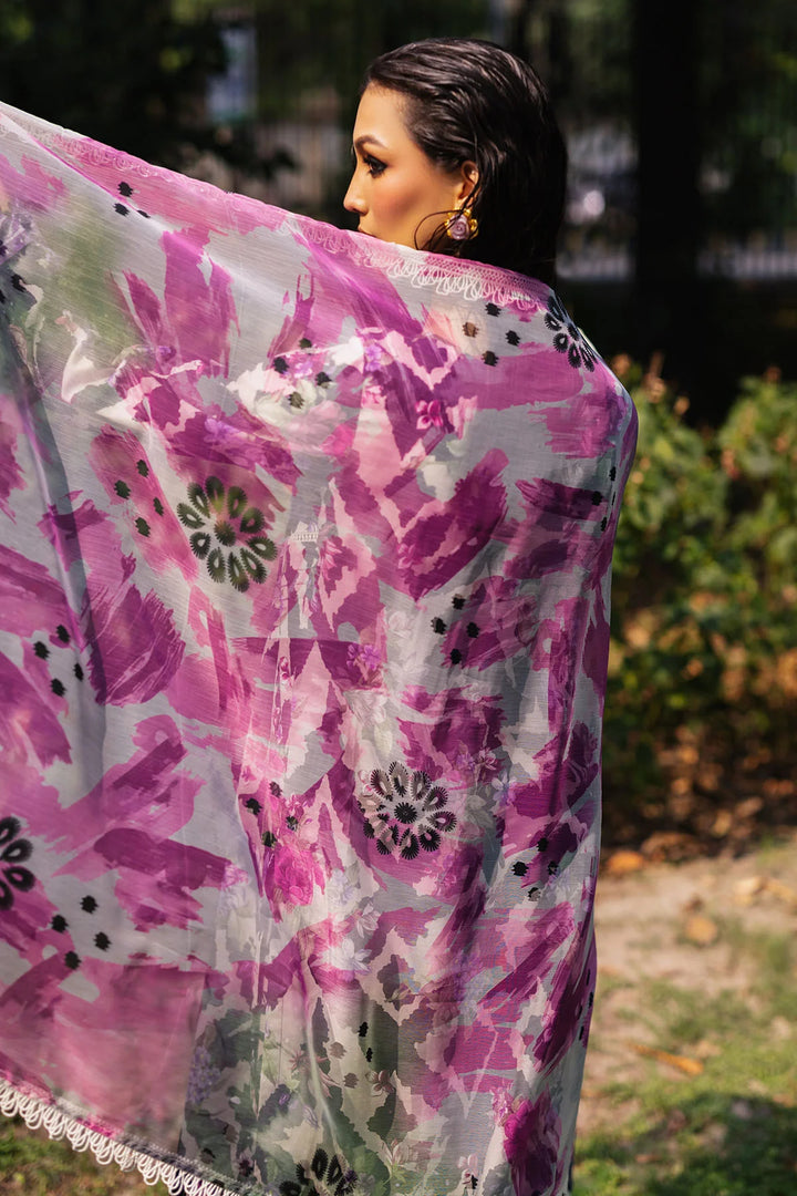 Side view of model showcasing Nureh designer lawn suit with elegant prints