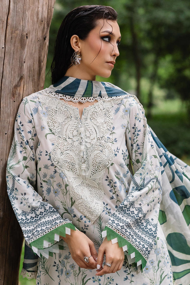 Side view of model showcasing Nureh designer lawn suit with elegant prints