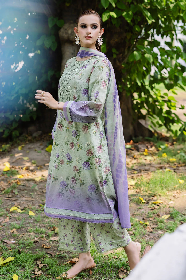 Side view of model showcasing Nureh designer lawn suit with elegant prints