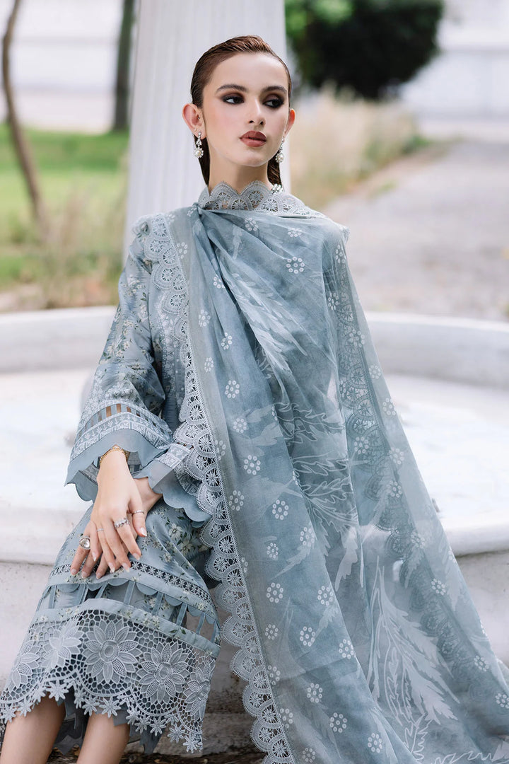 Model seated in Nureh lawn dress, highlighting fabric texture and elegance