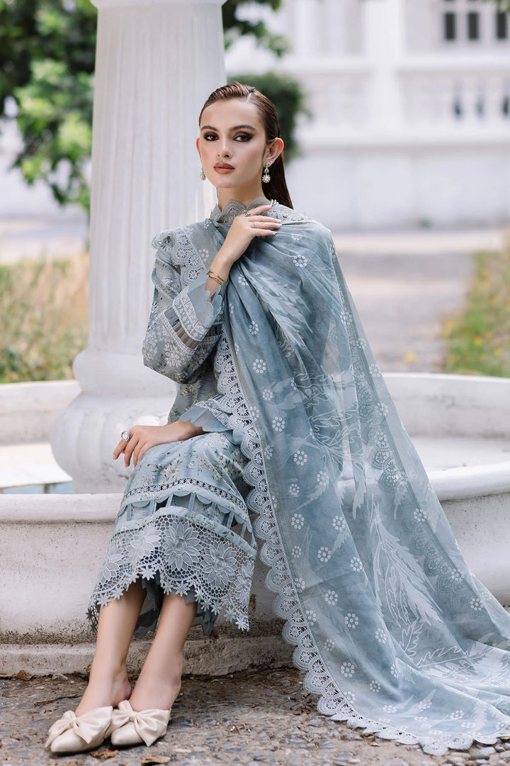 Model seated in Nureh lawn dress, highlighting fabric texture and elegance