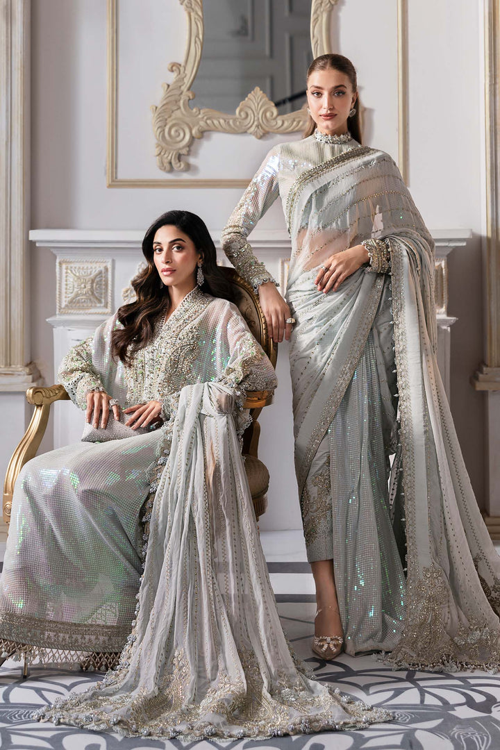 sitting down view of Maria B embroidered chiffon suit with hand-embellished organza neckline