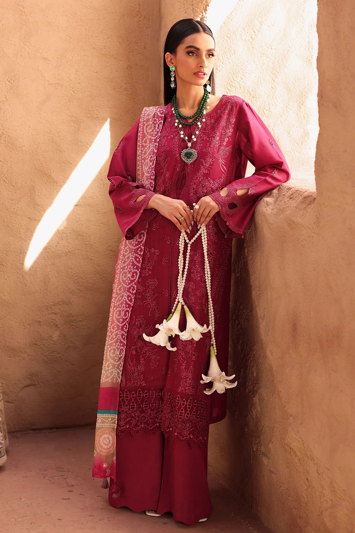 Model styled for formal event in Nureh embroidered lawn dress