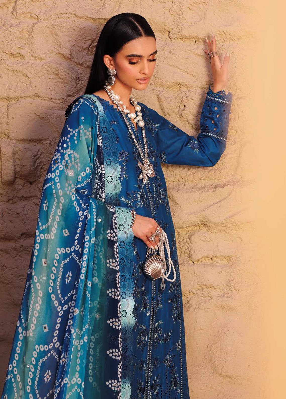 Model styled for formal event in Nureh embroidered lawn dress