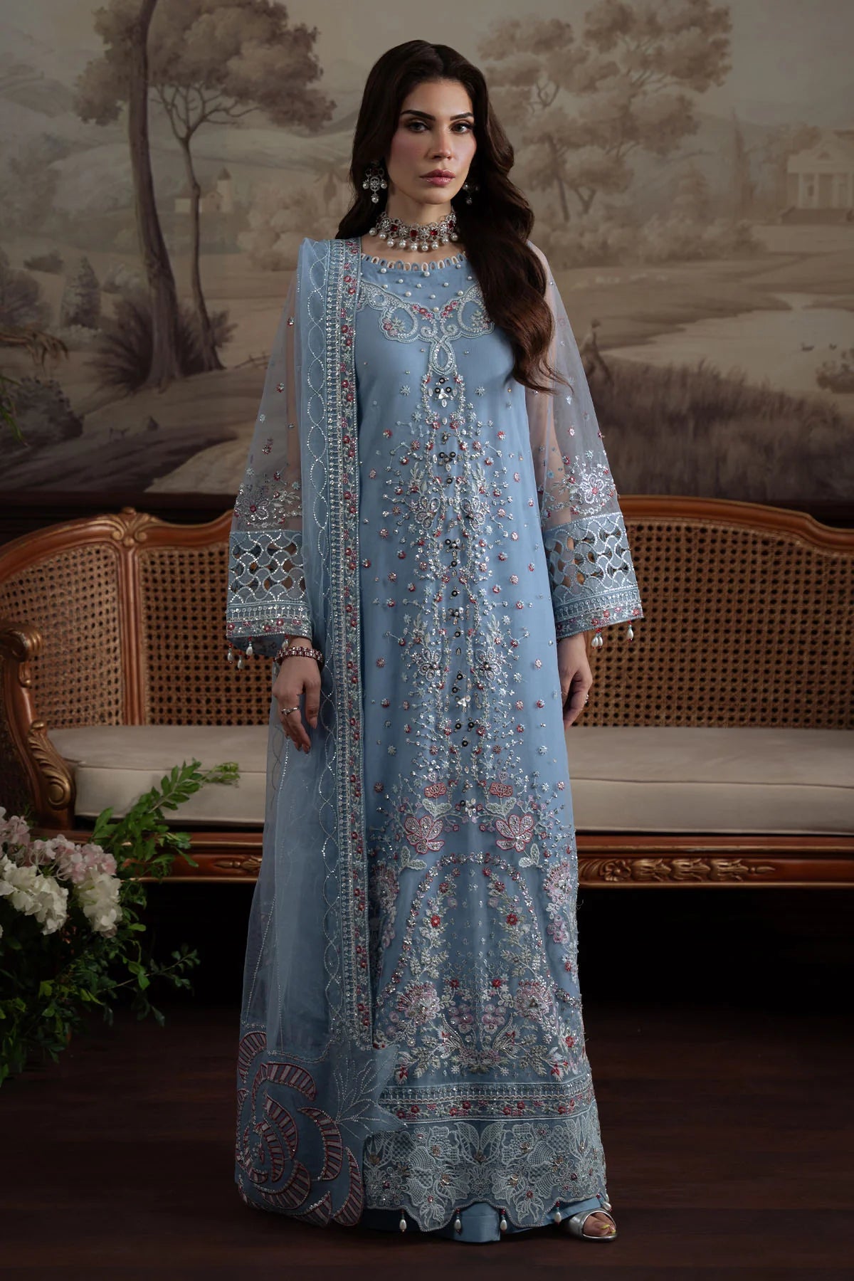 Full-length view showing embroidered dupatta and intricate floral embellishments on the suit