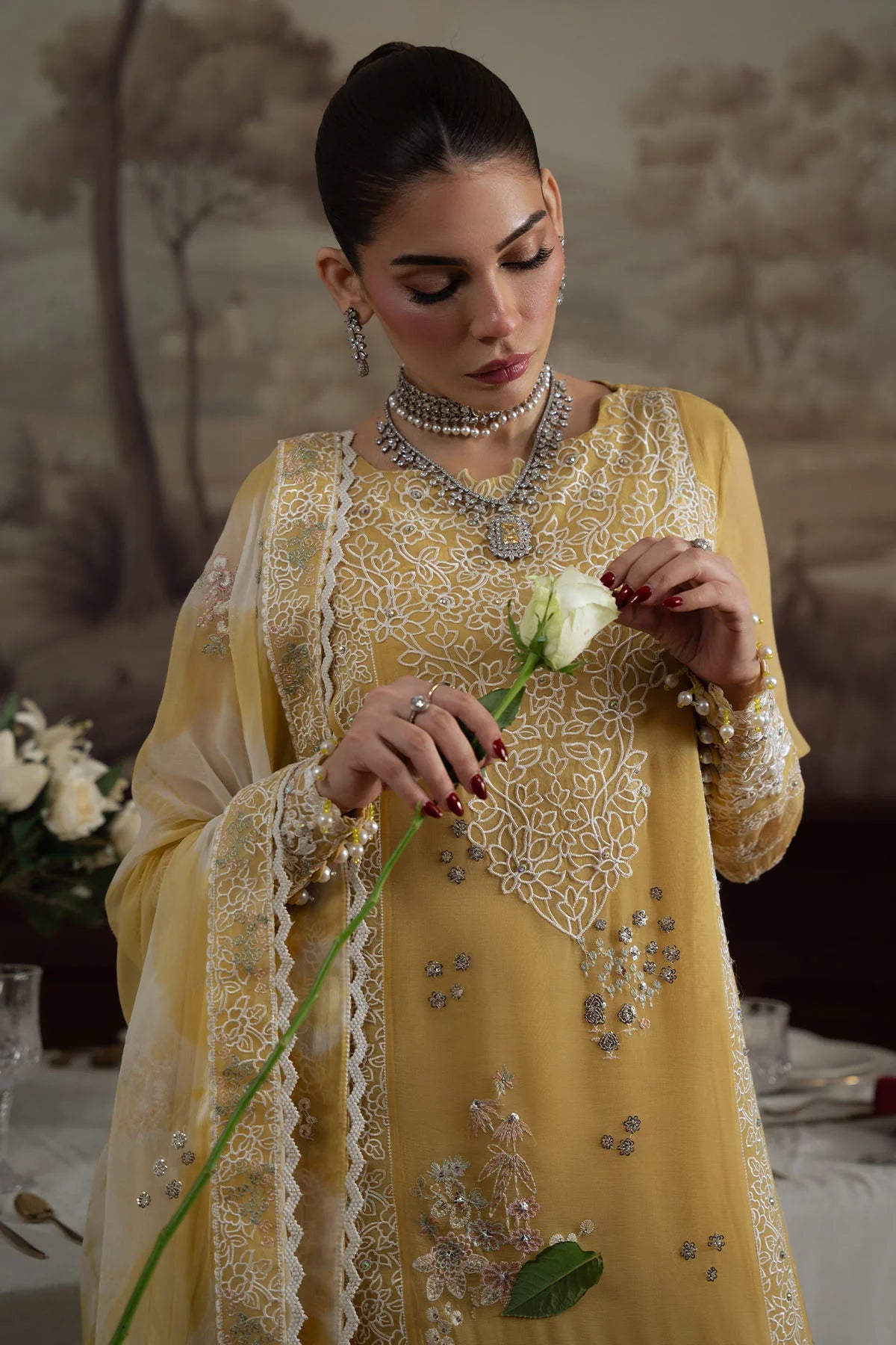 Close-up of neckline and sleeve embroidery on Nureh Elanora Style 76 with floral embellishments.