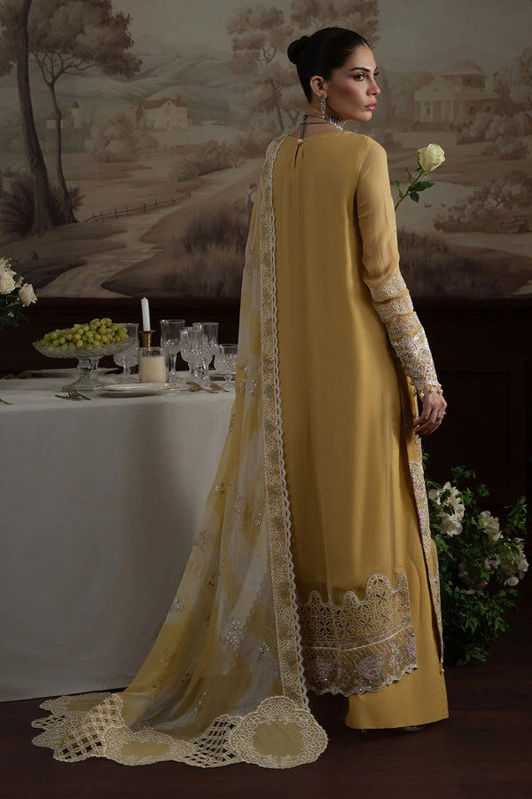 Model wearing Nureh Elanora Style 76 showcasing detailed embroidered sleeves and trailing embellished dupatta.