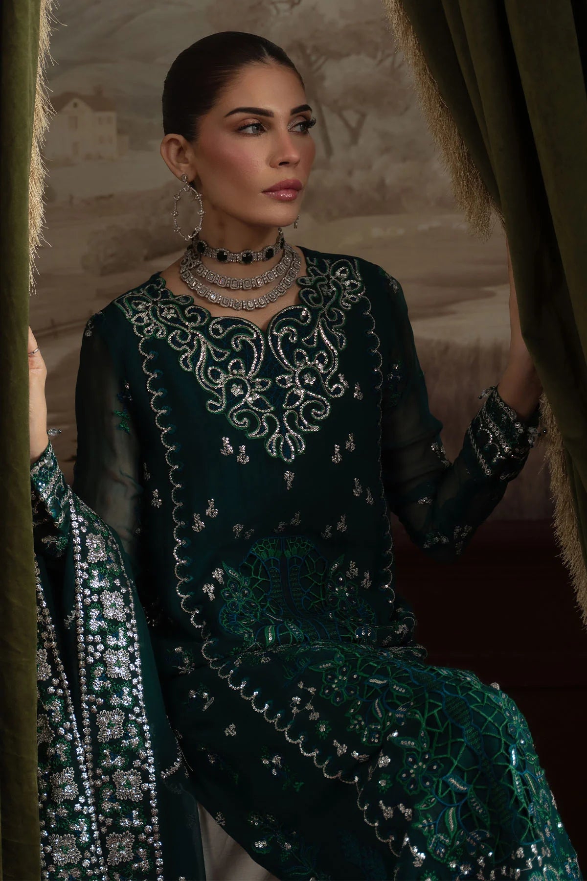 Close-up of model showcasing neckline embroidery and statement earrings in Nureh Elanora Style 77 suit