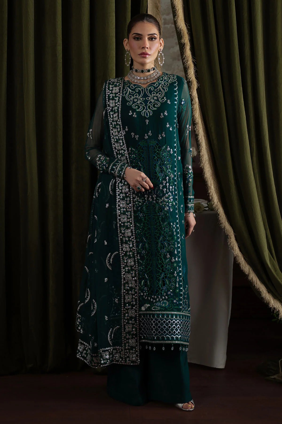 Full-length front view of model wearing Nureh Elanora Style 77 featuring hand-embellished chiffon and organza detailing